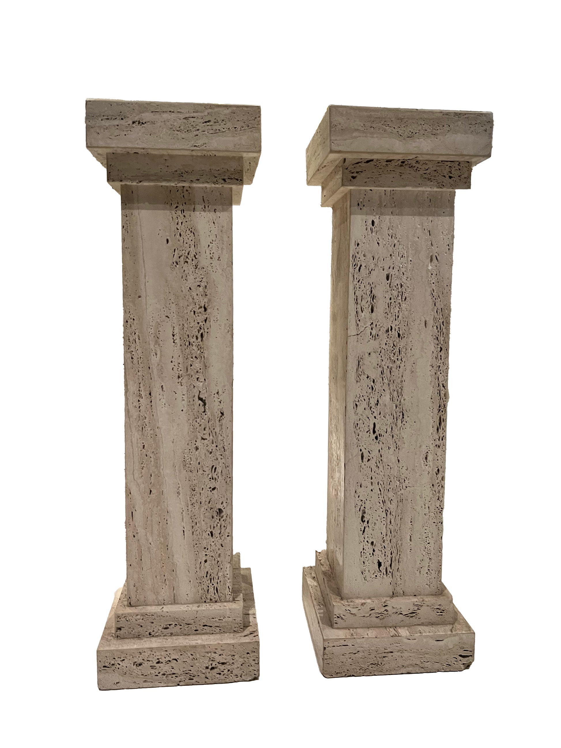 Pair of MCM travertine limestone pedestals, front view of clean-lined square columns.
