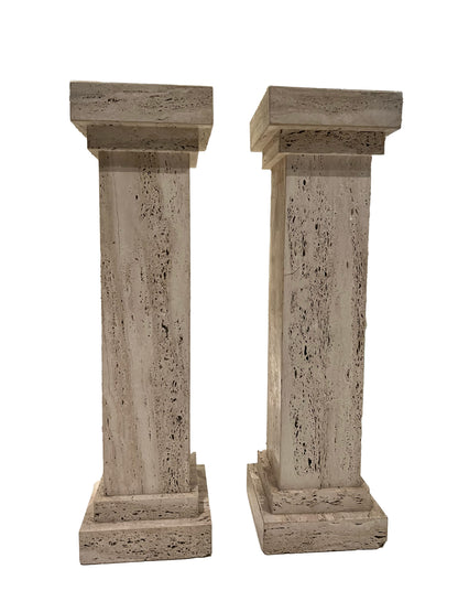 Pair of MCM limestone pedestals side by side, square travertine columns on stepped bases.