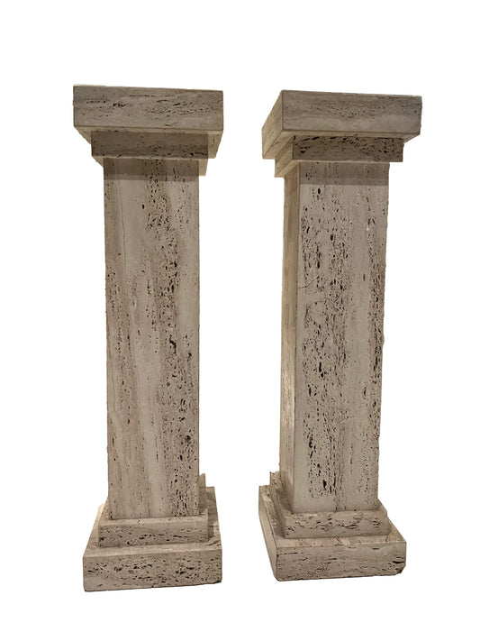 Pair of MCM limestone pedestals side by side, square travertine columns on stepped bases.