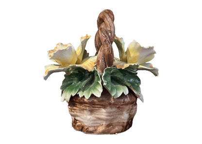 Capodimonte porcelain basket rear view: yellow blossoms and glossy green leaves over a brown base.