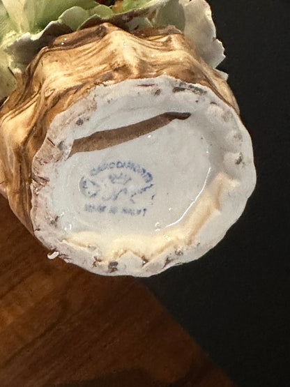 Underside of the Capodimonte basket showing the blue 'Capodimonte Made in Italy' maker's mark.