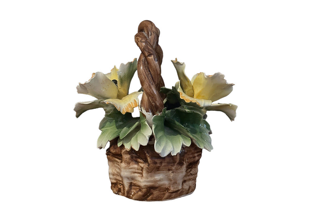 Capodimonte porcelain flower basket, rear view: twin yellow blossoms beside the braided handle.