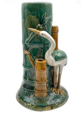 Majolica heron and bamboo vase, three-quarter view of heron among bamboo stalks