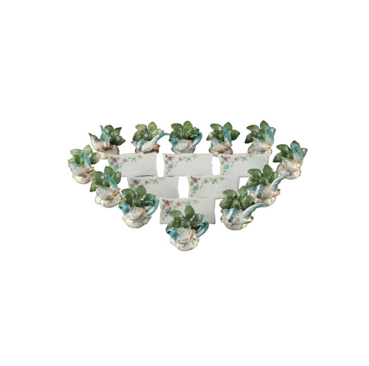 Full set of porcelain place card holders, turquoise birds among green leaves on white scalloped bases
