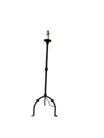 Vintage forged-iron floor lamp, full front view with tripod base and candlestick-style socket