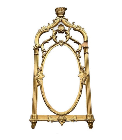 Vintage carved giltwood frame, front view of ornate openwork frame with empty oval center
