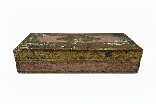 Florentine gilt-wood hinged box closed, distressed gold-leaf lid with faded pink and worn finish, pink sides