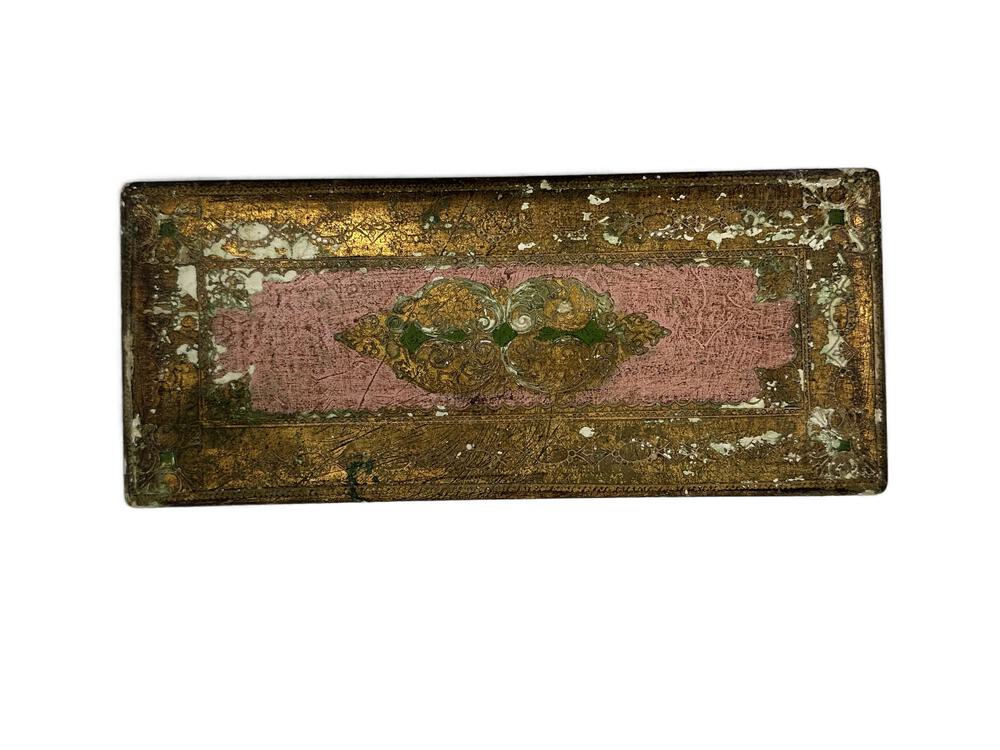 Top view of Florentine box lid, distressed gold-leaf border around faded pink panel with central floral motif