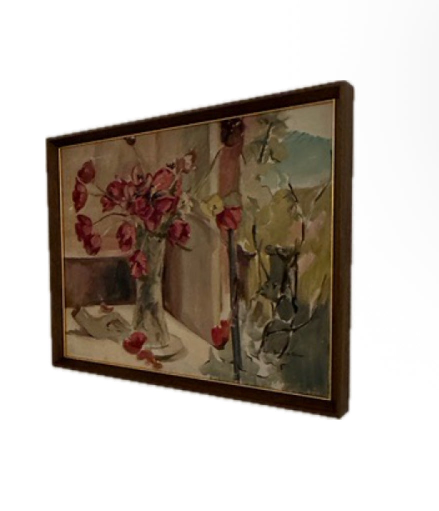 Angled view of the framed tulip still life, showing the painting and wood frame from the side.