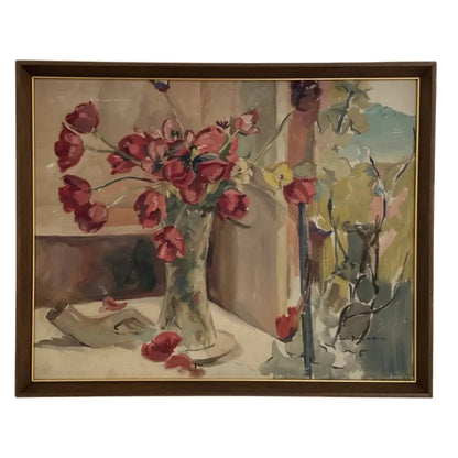 Framed vintage oil still life of red tulips in a glass vase by a window, in a wood frame with thin gold liner.
