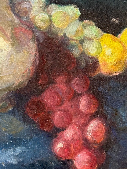 Vintage still life painting, close-up of red and green grapes and a yellow lemon