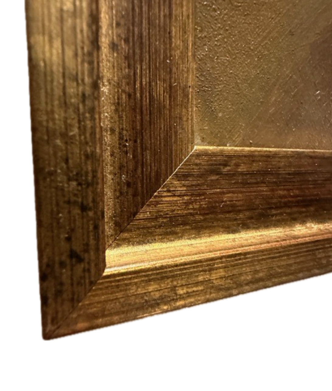 Close-up of gold-painted wood frame corner showing grain and gilt finish