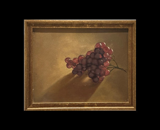 Grapes still life oil painting in gilt frame, front view against black backdrop