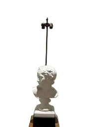 Distant full view of the plaster bust table lamp with bare brass rod and twin sockets