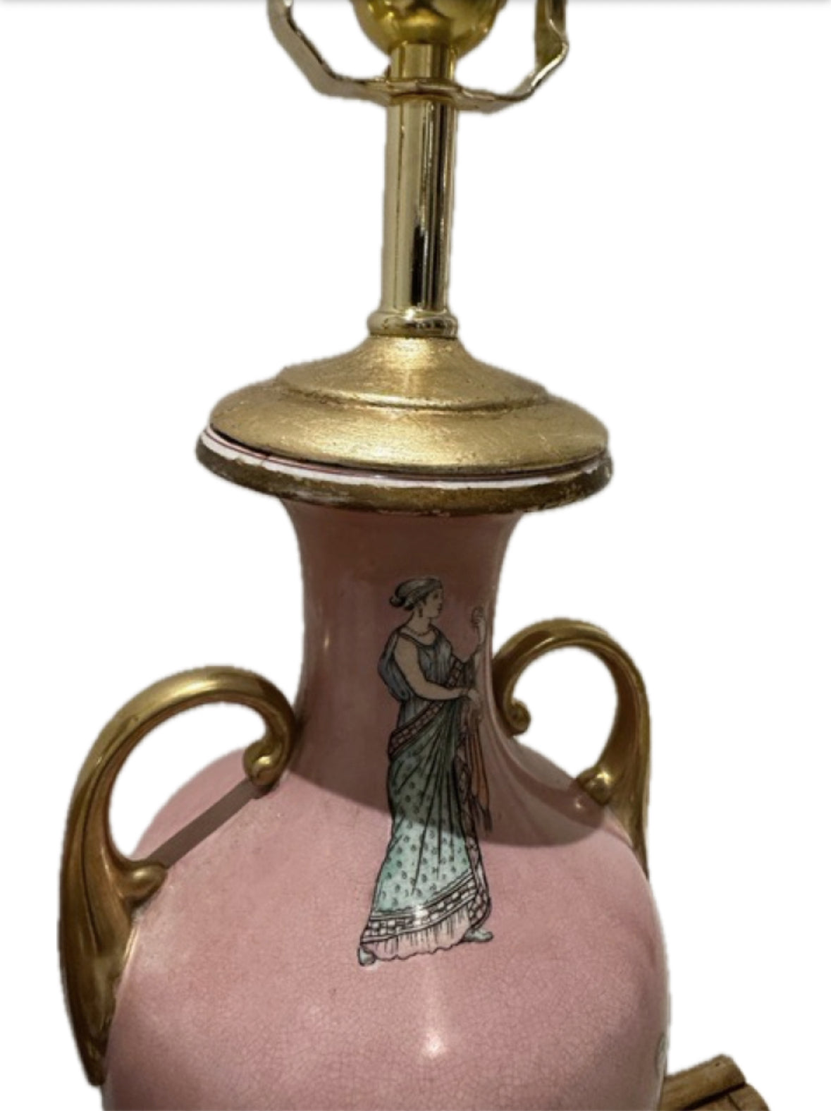 Detail of a pink lamp's worn gilt neck cap and painted classical maiden figure