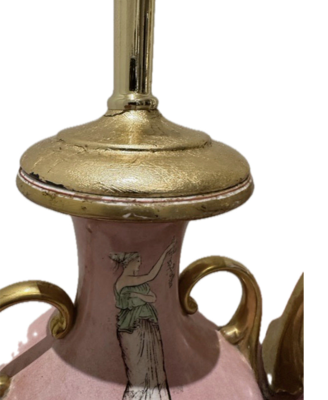 Detail of a pink lamp's gilt neck cap with visible wear above a painted classical figure