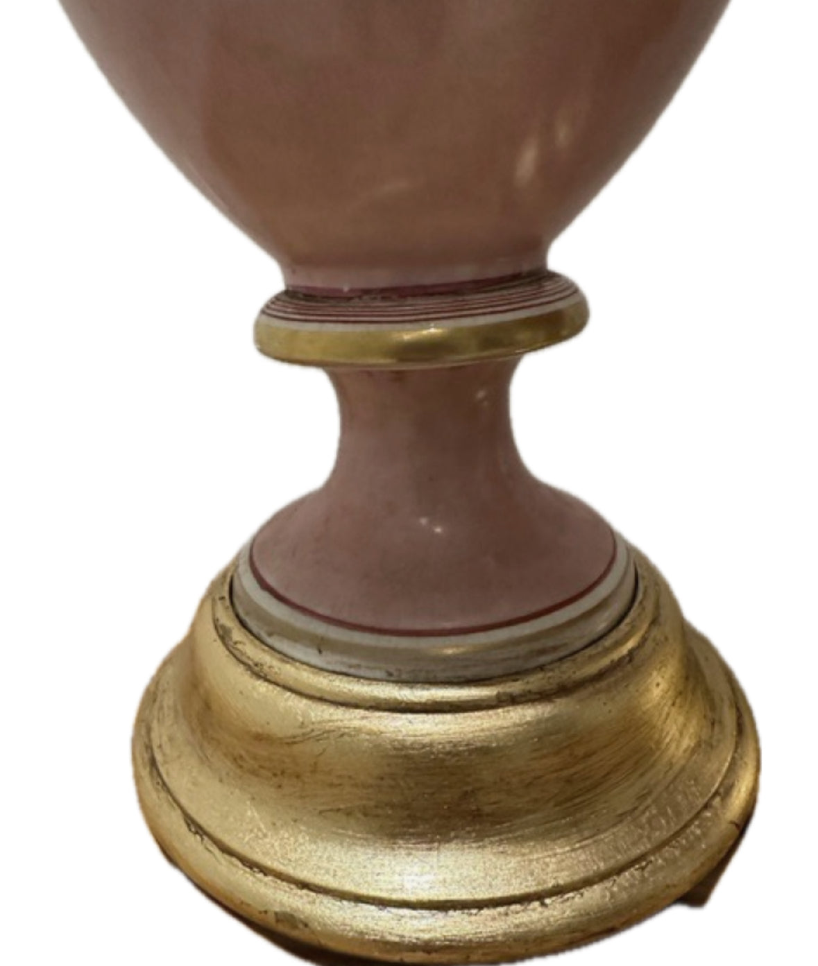 Close-up of a pink lamp's gilt turned-wood round base
