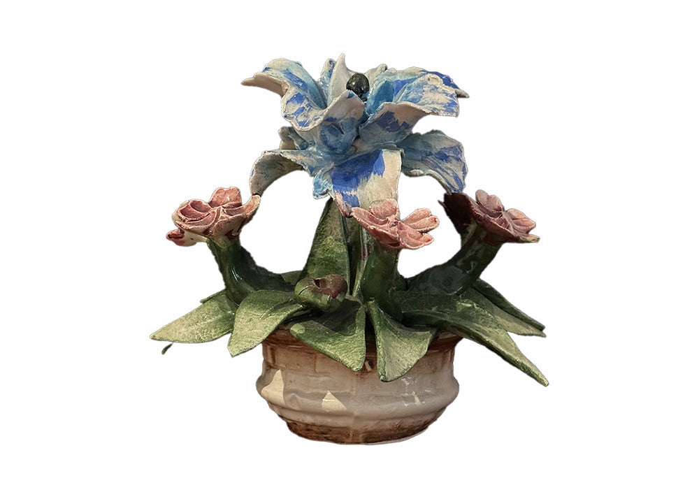 Capodimonte porcelain flower arrangement in woven basket pot, blue lily-like bloom and pink roses among green leaves
