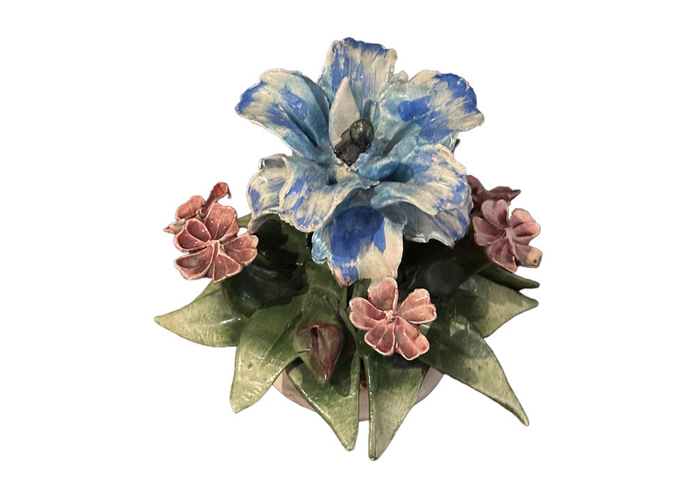 Capodimonte porcelain floral arrangement; large blue-and-white central bloom with pink flowers and green leaves