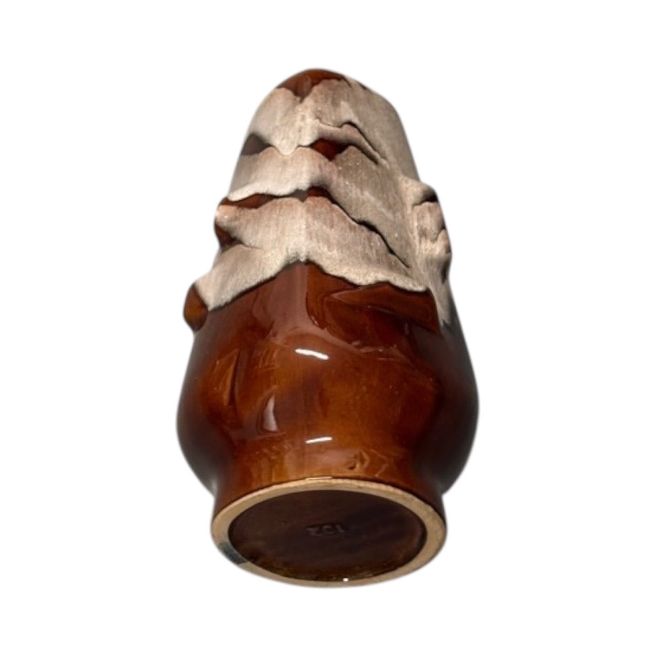 Underside view of the MCM drip glaze vase, glossy brown rounded base with cream glaze at the top.