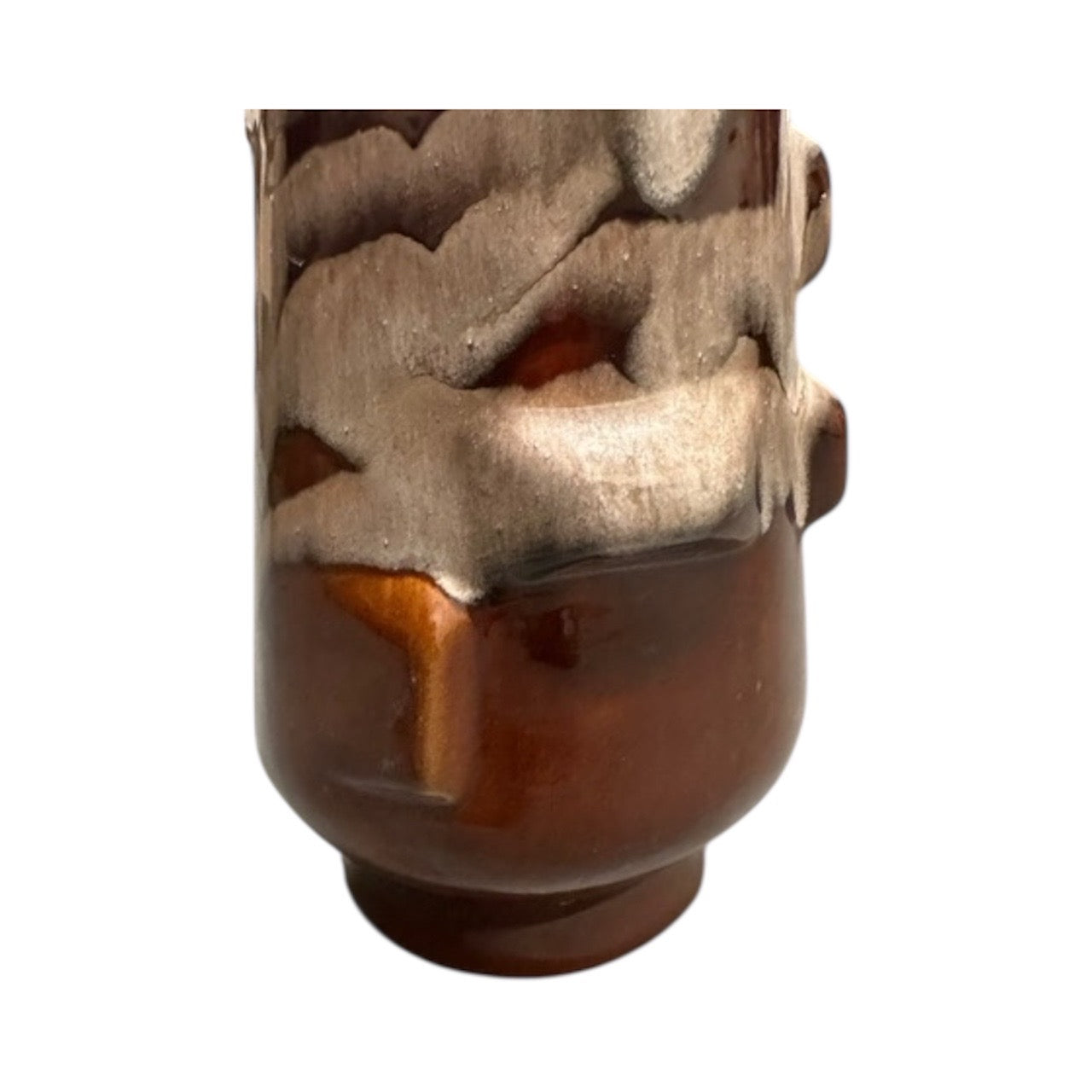 Close-up of the MCM drip glaze vase's lower body, glossy caramel-brown glaze beneath a thick cream drip.