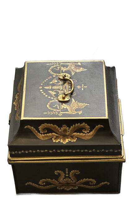 Vintage tole hinged box, angled top view with brass handle and gilt bird-and-foliate lid decoration