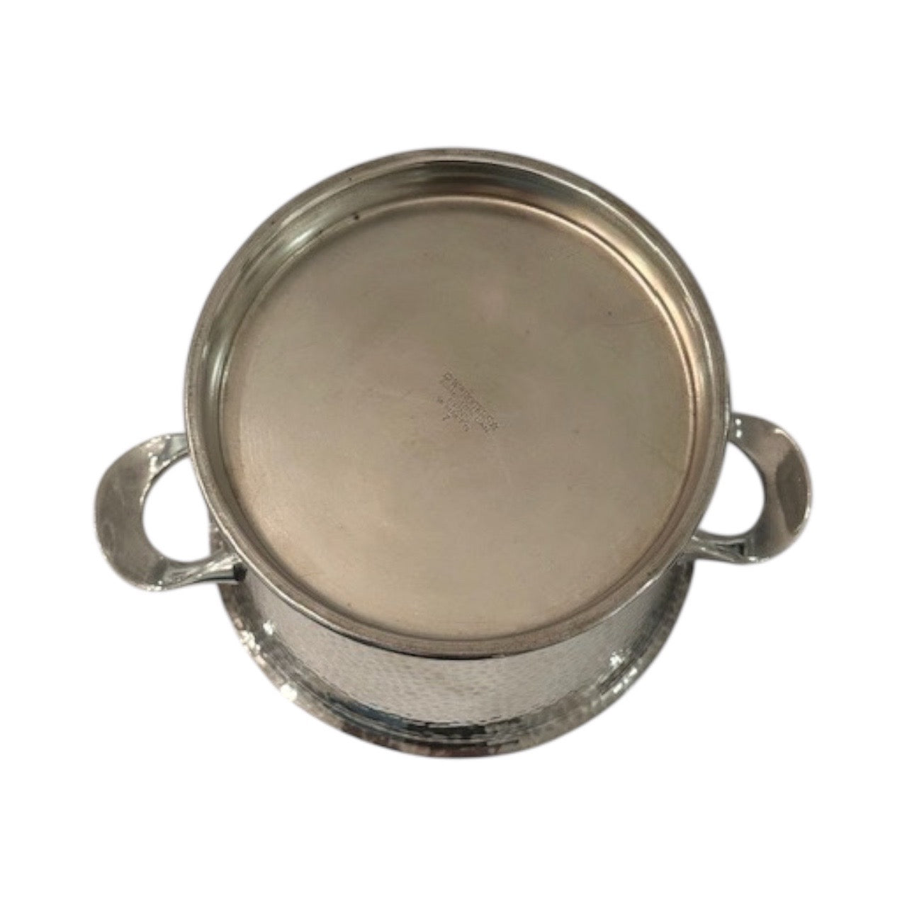 Hammered silver-plate ice bucket, underside view showing the footed base and faint maker's stamp
