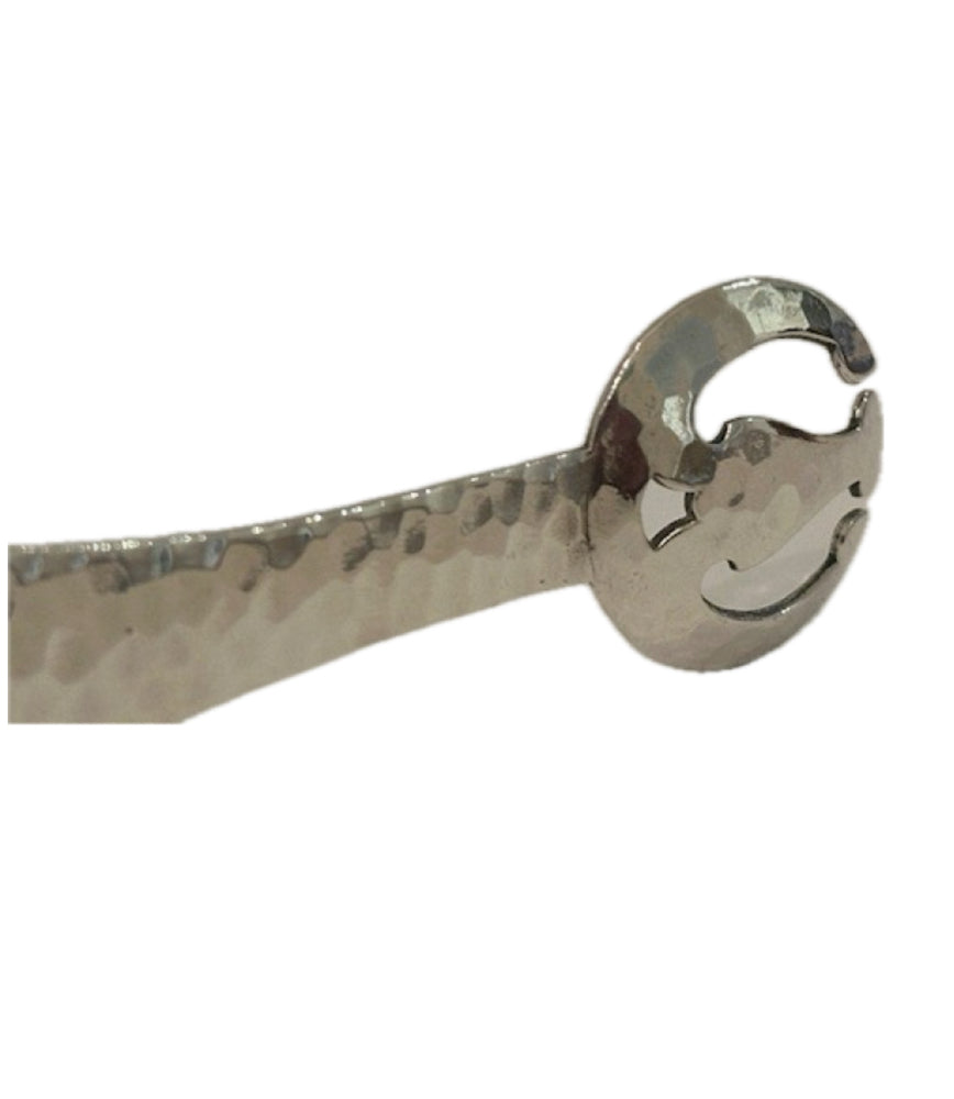 Silver-plate ice tongs; close-up of one rounded hammered claw grip