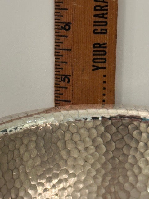 Hammered silver-plate ice bucket; close-up of the hammered body measured against a ruler
