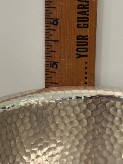 Hammered silver-plate ice bucket; close-up of the hammered body measured against a ruler