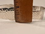 Hammered silver-plate ice bucket measured against a wooden ruler to show its width