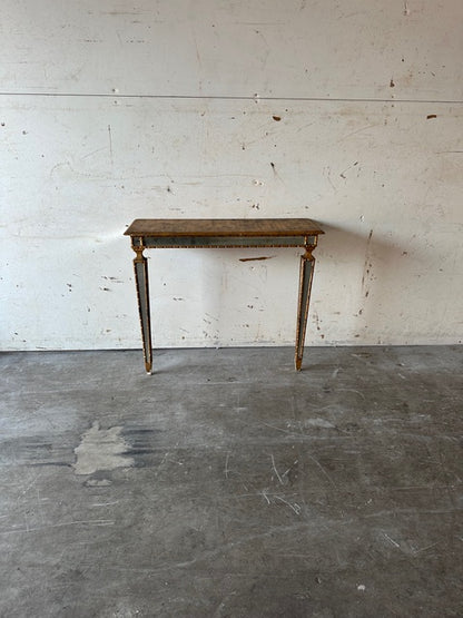 Italian pier table, front elevation against a wall, gilt wood with mirror accents