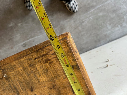 Close-up of the pier table's top edge with a tape measure showing depth