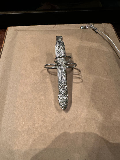 Silver plate asparagus utensil with foliate-embossed handle and three finger loops
