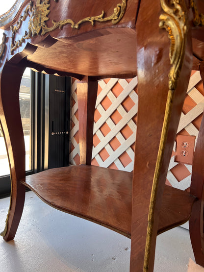 Close-up of the side table's lower tier and cabriole legs with ormolu mounts