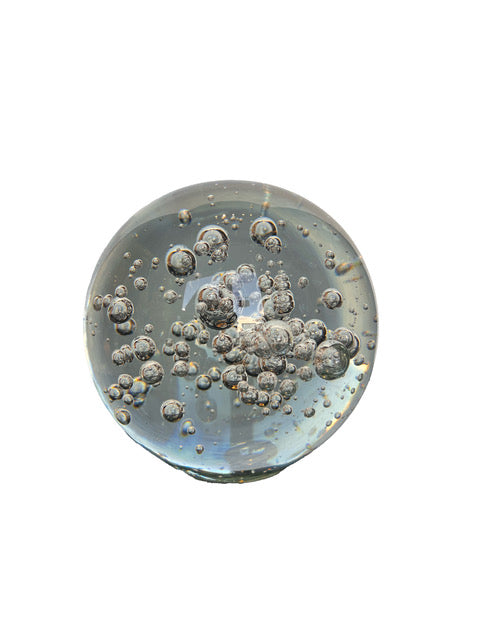 MCM controlled bubble glass sphere, clear and heavy with a cluster of internal bubbles
