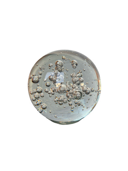 MCM clear controlled-bubble glass sphere showing scattered suspended bubbles within