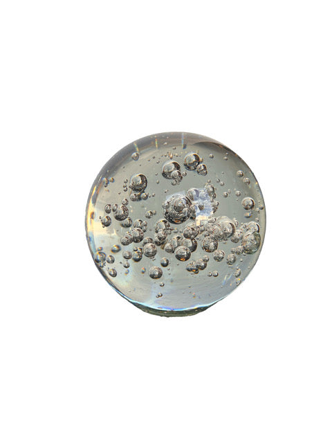 MCM controlled bubble glass sphere, clear glass with a dense cluster of internal bubbles
