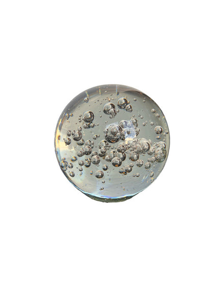 MCM controlled bubble glass sphere, clear glass with a dense cluster of internal bubbles