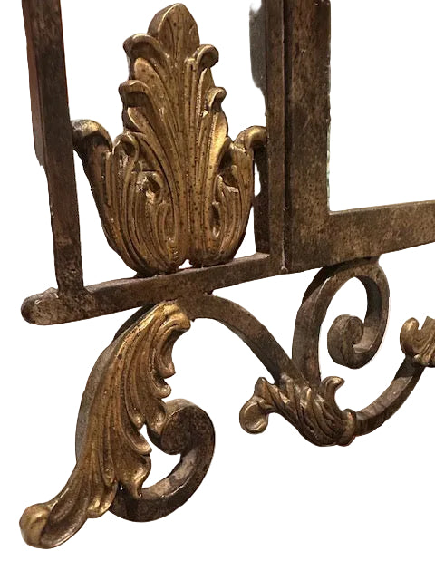 Close-up of the La Barge mirror's lower corner with gilded acanthus leaf and scrolling wrought-iron detail.