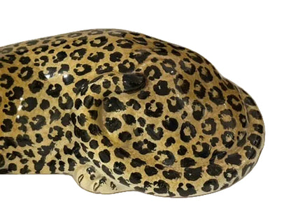 Close-up of majolica leopard's hand-painted spotted back and reclining body