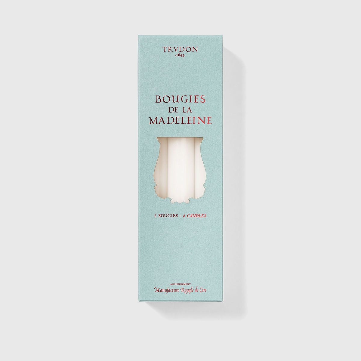 Trudon Bougies de la Madeleine pale blue box with white taper candles shown through the cutout window
