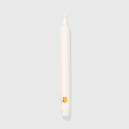 Trudon Madeleine ivory-white taper candle with gold Trudon emblem, shown full length