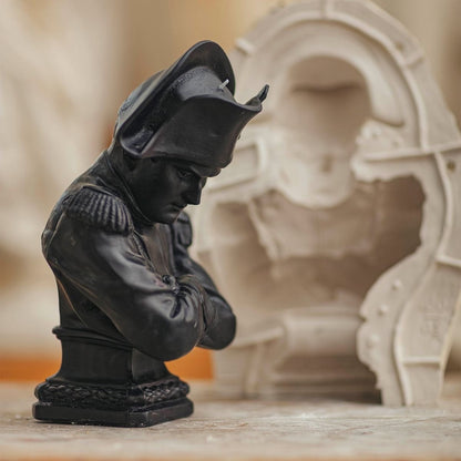 Trudon Napoleon black bust candle in an atelier beside a pale plaster casting mold