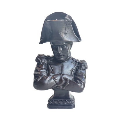Trudon Napoleon bust candle in black wax, bicorne hat and crossed arms, front view
