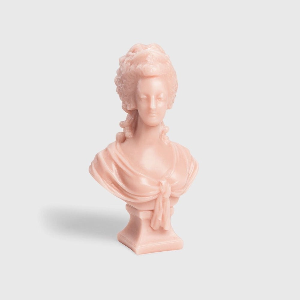 Trudon Marie-Antoinette bust candle in rose-pink wax on a square plinth, front view