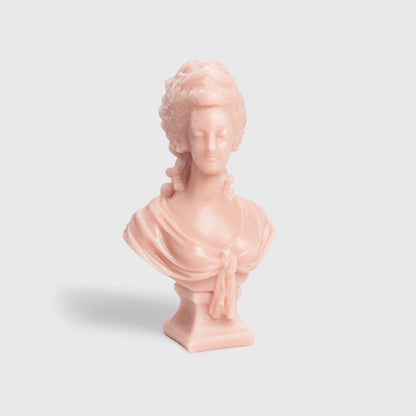 Trudon Marie-Antoinette bust candle in rose-pink wax on a square plinth, front view