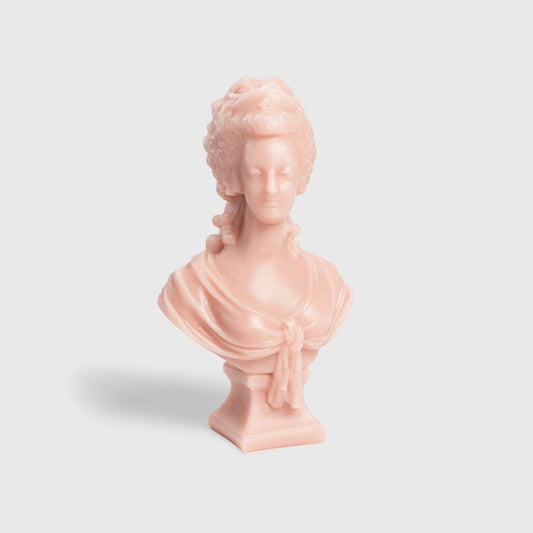 Trudon Marie-Antoinette bust candle in rose-pink wax on a square plinth, front view