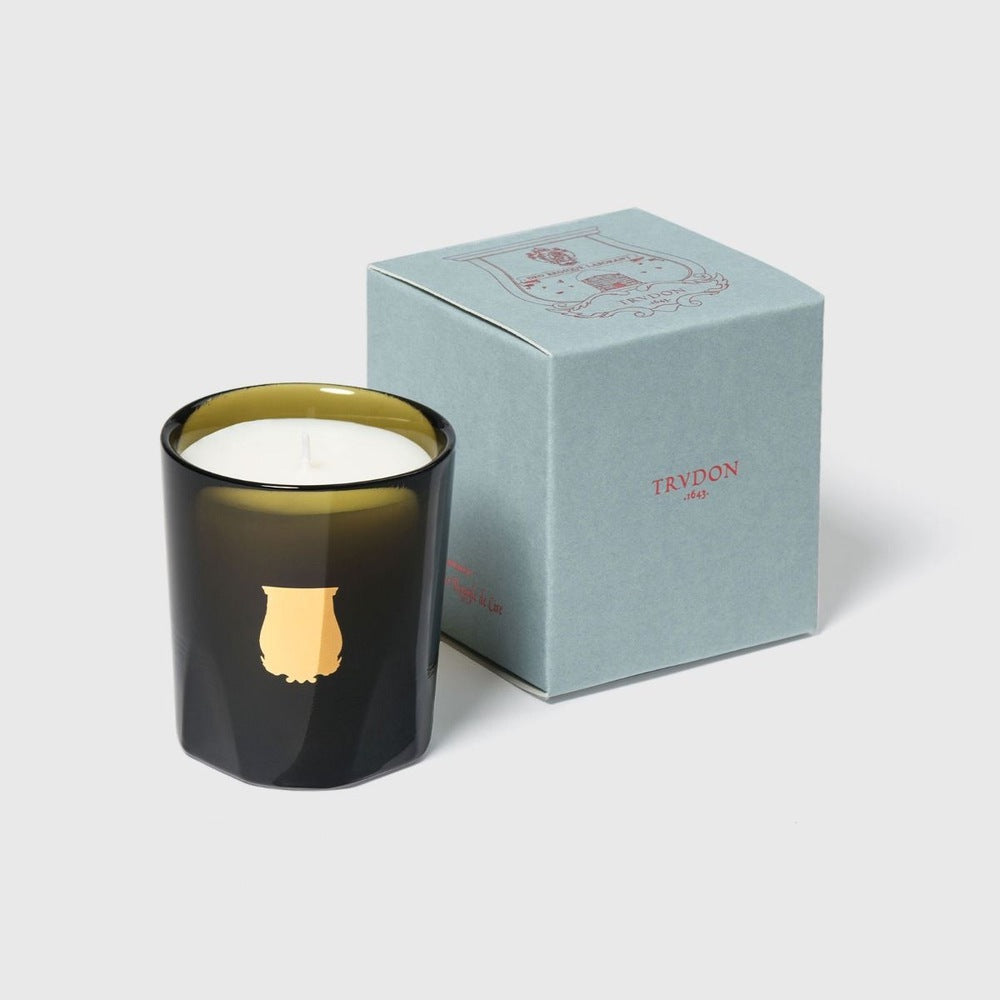 Trudon Cyrnos petite candle beside pale aqua 'Trudon 1643' gift box with red crest