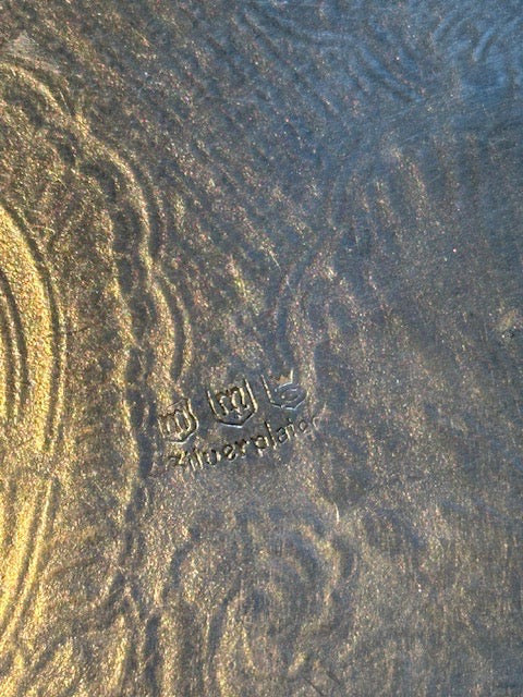 Close-up of maker's mark and 'Silverplate' hallmark on round tray underside